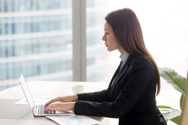 istock Successful serious business lady working at office desk using laptop 680437146