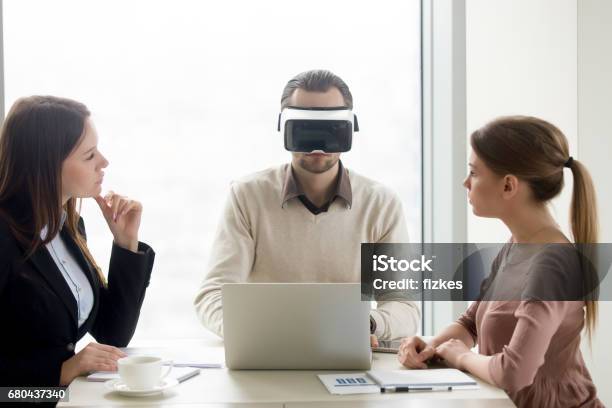 Man Wearing Vr Headset Team Developing Virtual Reality Glasses Software Stock Photo - Download Image Now