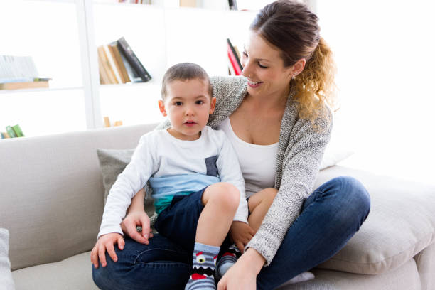 istock Beautiful young mother and her son having fun at home. 680437768