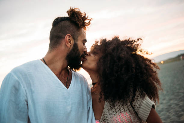 istock Couple kissing at the beach 680443688