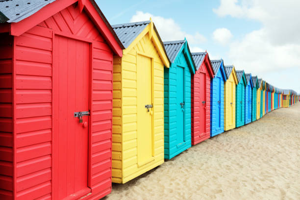 Beach huts or bathing boxes on the beach Beach huts or colorful bathing boxes on the beach beach hut stock pictures, royalty-free photos & images