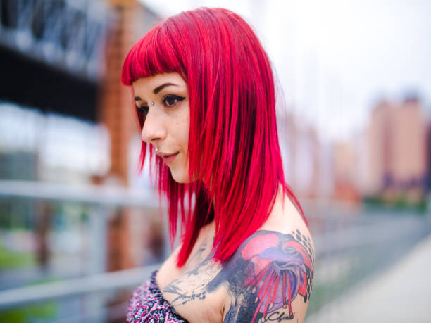 istock redhead tattooed girl portrait 680446246