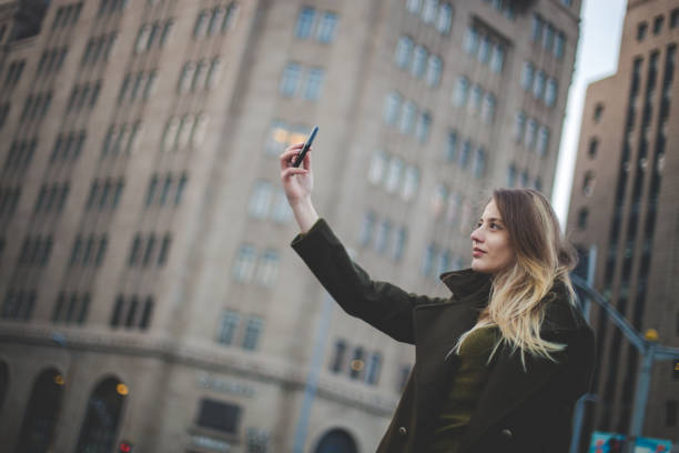 istock Beautiful woman taking selfies 680446592