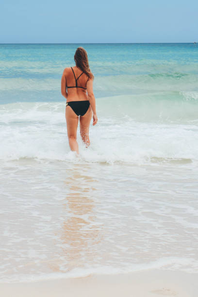 istock Women enjoying time on the beach 680450048