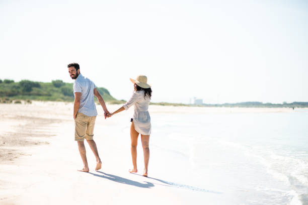 istock happiness couple doing a vacation at seaside 680458292