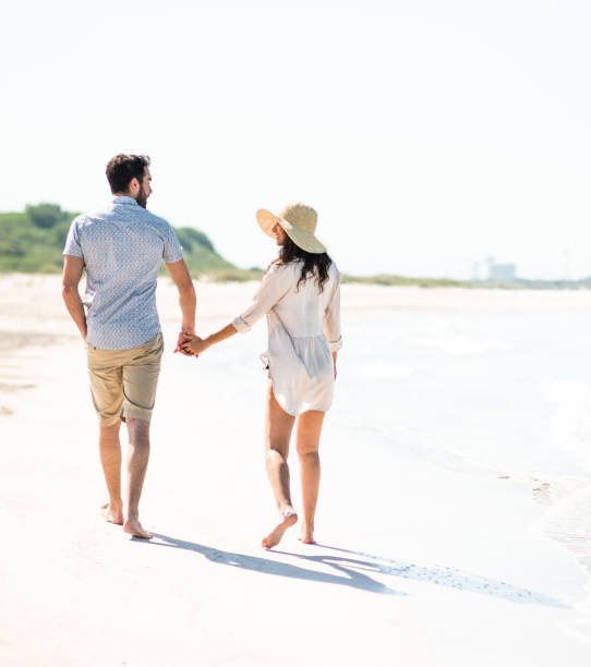 istock happiness couple doing a vacation at seaside 680460688