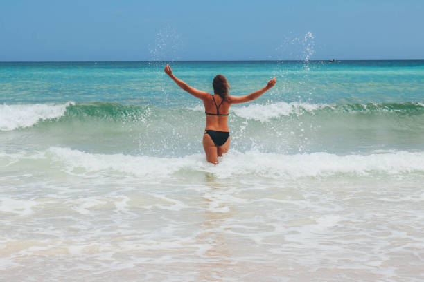 istock Women enjoying time on the beach 680460836