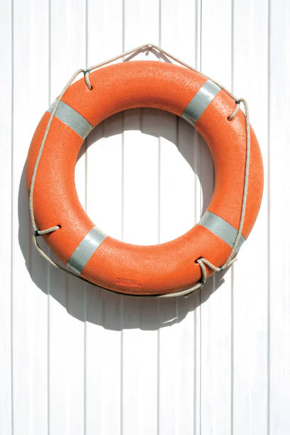 istock Orange lifebuoy on fence. 680461400