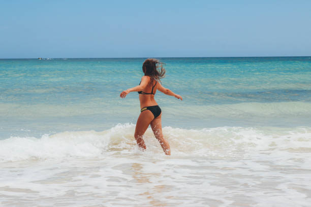 istock Women enjoying time on the beach 680461540