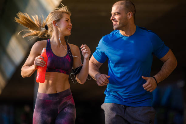 istock Couple running in an urban environment 680461576