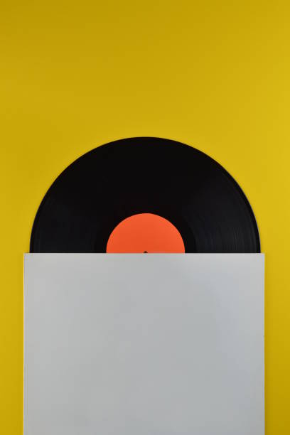 istock black vinyl record halfway out of white blank cover 680465666