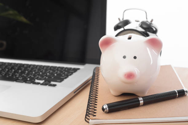 istock workplace with piggy bank and computer on desk office. 680470780