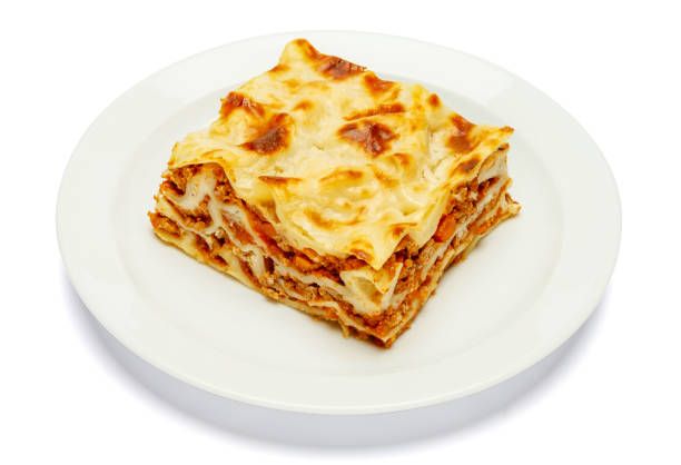 istock Portion of tasty lasagna isolated on white 680471212