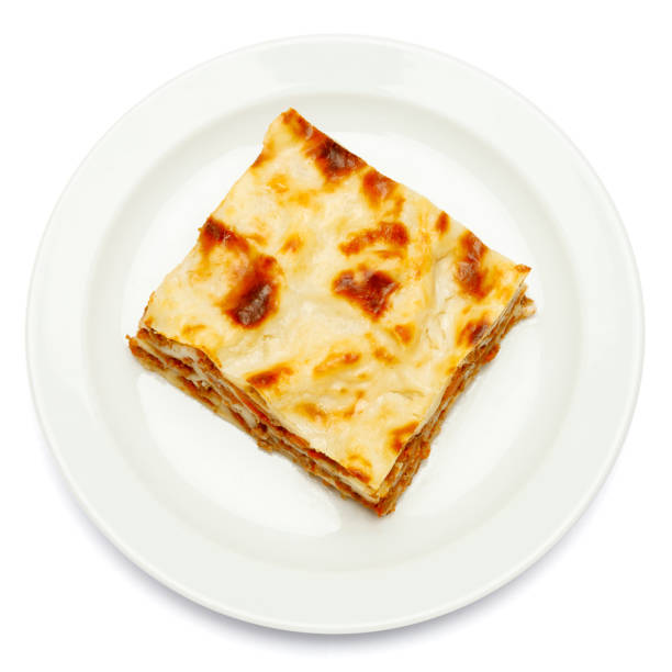 istock Portion of tasty lasagna isolated on white 680471304