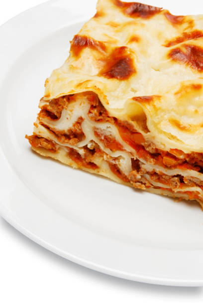 istock Portion of tasty lasagna isolated on white 680471706