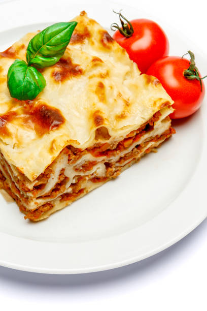 istock Portion of tasty lasagna isolated on white 680472230