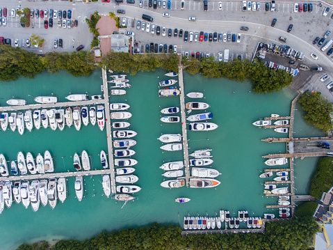 Phuket, Thailand - January 15, 2023: An elevated drone aerial view of a marina located in Phuket, Thailand.