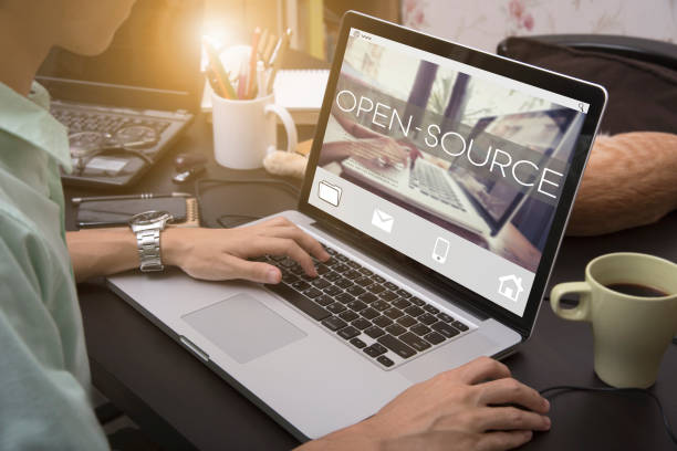 istock business hand typing on a laptop keyboard with Open Source homepage on the computer screen developer program software user concept. 680474832