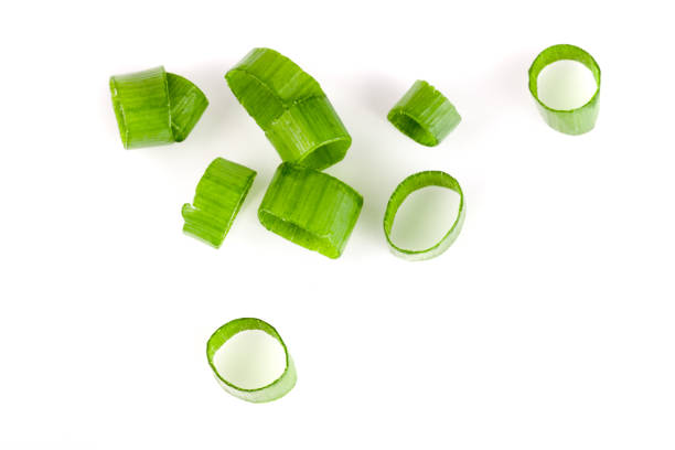 istock Chopped fresh green onions isolated on white background. Top view 680478974