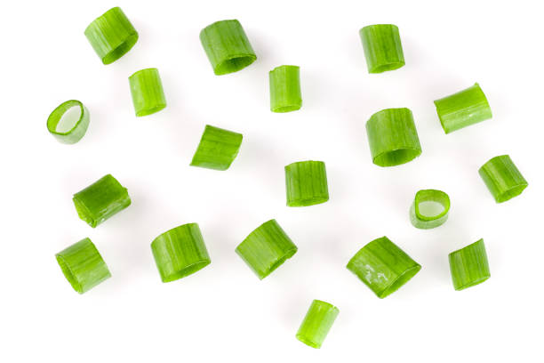 istock Chopped fresh green onions isolated on white background. Top view 680479050