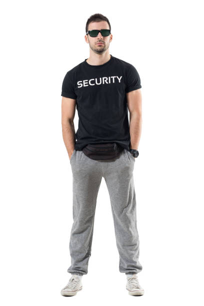 istock Tough confident macho young undercover cop with hands in pockets looking at camera 680479516