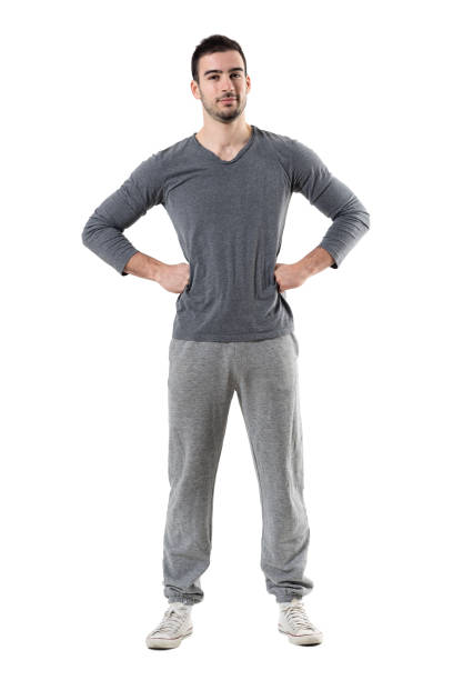 istock Confident young sporty athlete with hands on hips looking at camera 680481910
