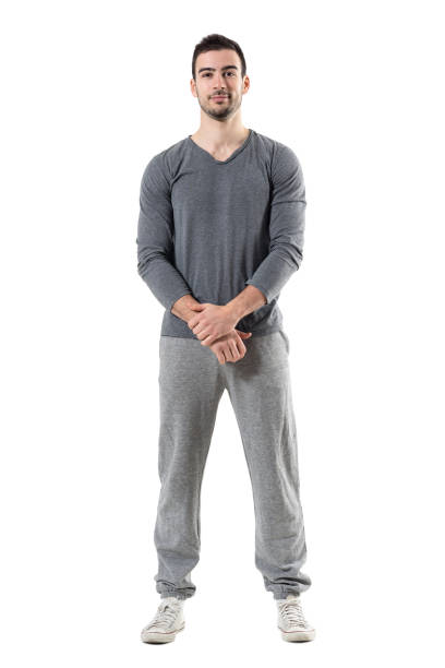 istock Friendly smiling young sporty fit man with clasped hands looking at camera 680482188