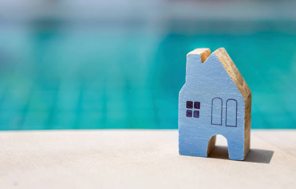istock Wooden blue miniature house 680486012