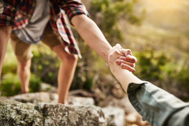 istock Alone we climb rocks, together we climb mountains 680486502