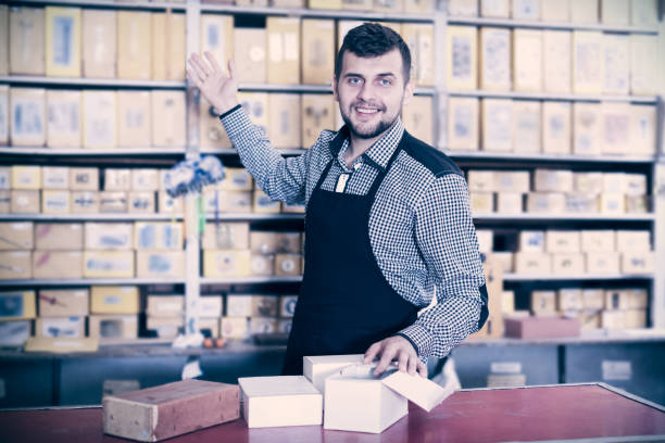istock Man seller showing diverse assortment 680493842