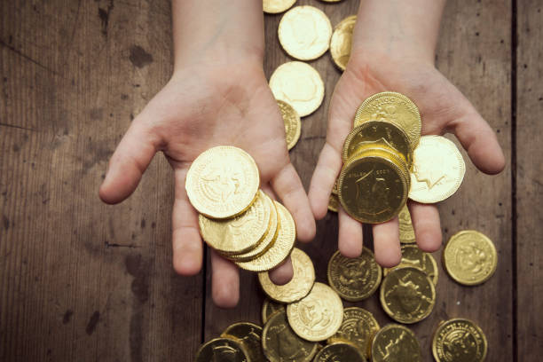 istock Coin in children hand 680497164