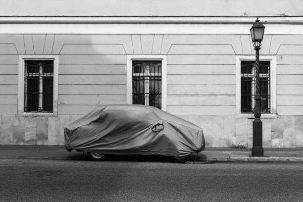 Car covered with textile cover stock photo