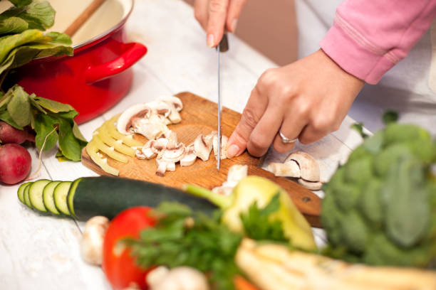 istock Slicing of fresh champignons in the kitchen 680498516