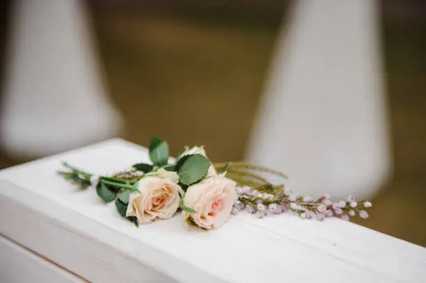 Roses on the wedding box. Ceremony. Wedding decorations.