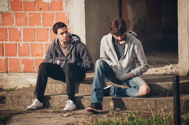 istock Two depressed and sad young buddies friends thinking about problems 680510986
