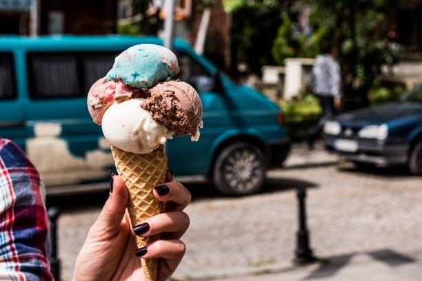 istock Girl Holding ice cream in the cone. 680510992