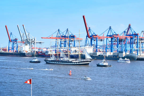 Hamburg harbor, birthday parade with various ships Hamburg harbor, birthday parade with various ships. View to Hamburg harbor with harbor cranes. övelgönne stock pictures, royalty-free photos & images