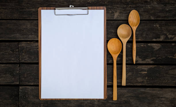 istock Blank paper clipboard and wooden spoon 680514260