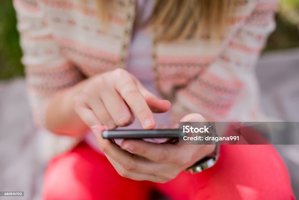 Get your message across with smart technology Texting woman close-up. Girl waits .Mock up black mobile. Copyspace for text. Girl use smartphone. technology, communication age and people concept 20-29 Years Stock Photo