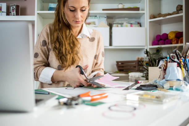 istock Designer cutting colorful paper 680523686