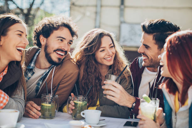 istock Friends drinking cocktails outdoors 680523702