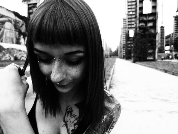 istock tattooed girl black and white portrait 680530054