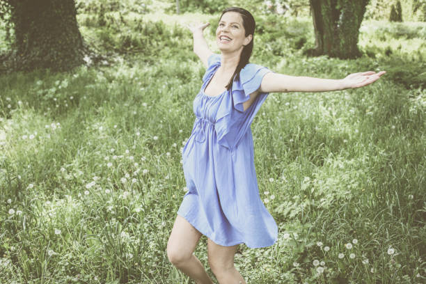 istock Young pregnant woman enjoy in spring day. 680530082