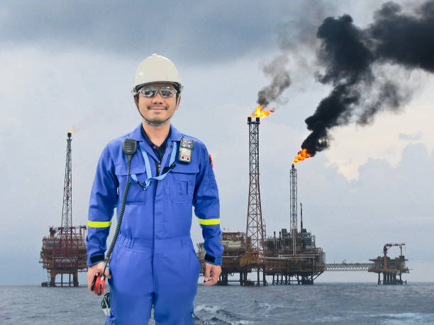 istock Working engineer at offshore oil and gas refinery 680541332