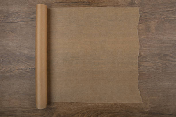 istock Baking paper on wooden background top view. 680542432