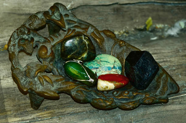 Frog figurine on the river bank.