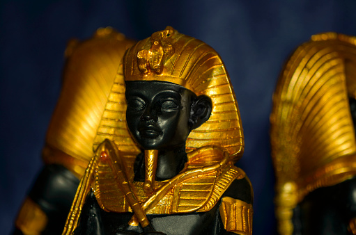 Golden ancient egyptian pharaohs statuette