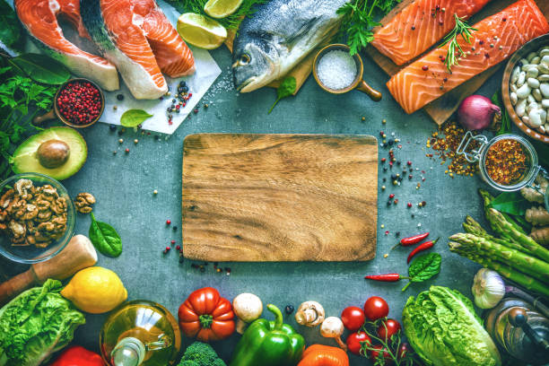 istock Assortment of fresh fish with aromatic herbs, spices and vegetables 680547716