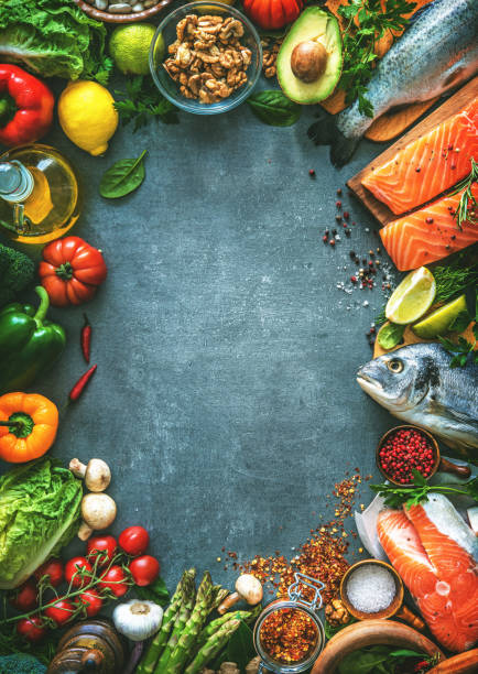 istock Assortment of fresh fish with aromatic herbs, spices and vegetables 680547722