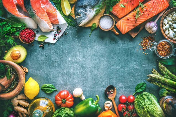 istock Assortment of fresh fish with aromatic herbs, spices and vegetables 680547724